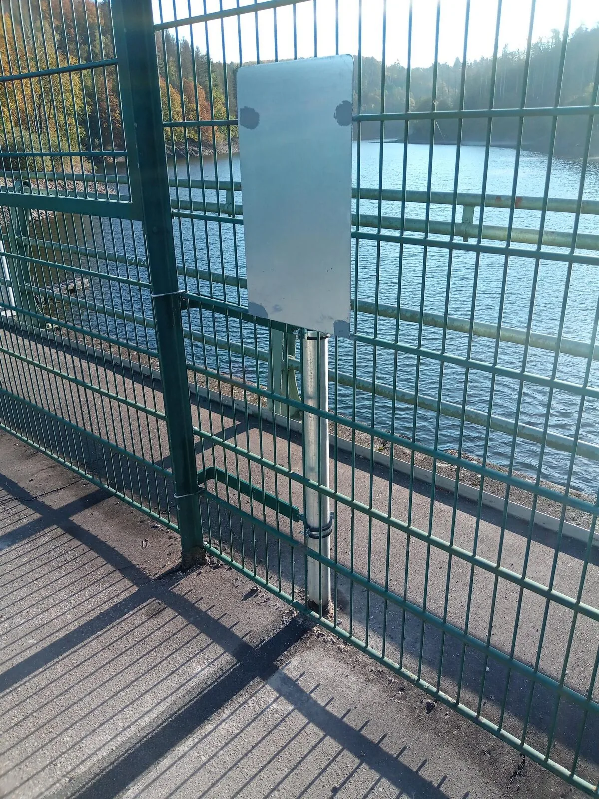 Gauge tube on the railing at a reservoir